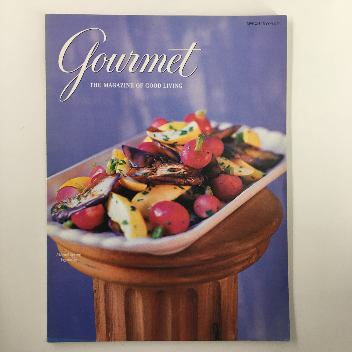 Cover of Gourmet Magazine March 1997 featuring a vibrant arrangement of minted spring vegetables, highlighting the theme of Easter Dinner.