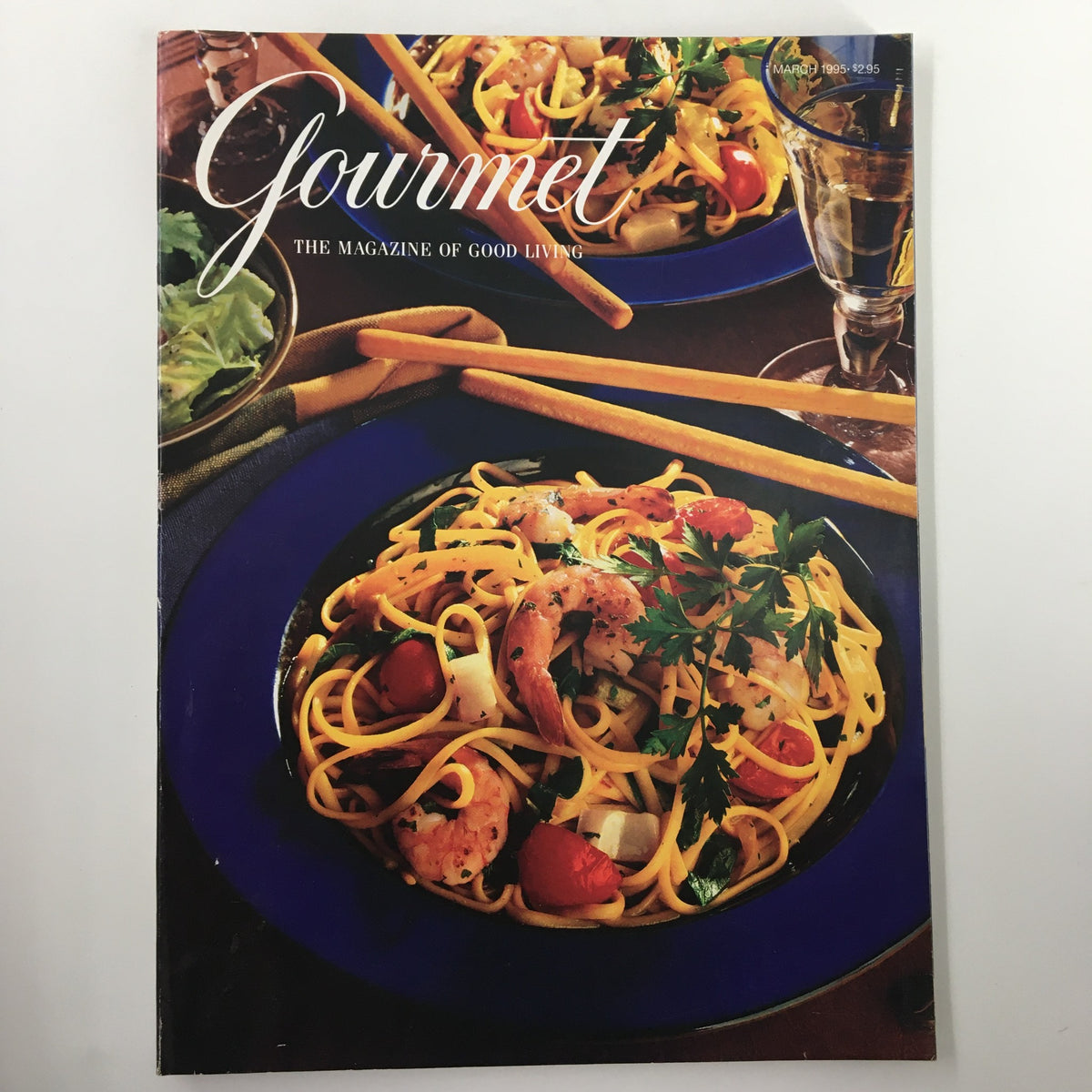 Gourmet Magazine March 1995 cover showcasing a vibrant pasta dish with shrimp and vegetables, emphasizing culinary art and food photography.