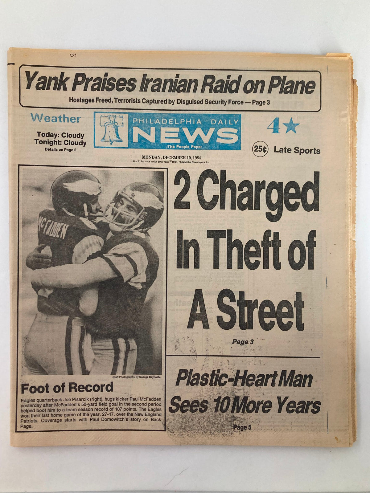 Philadelphia Daily News Tabloid December 10 1984 featuring Joe Pisarcik and Paul McFadden on the front cover, highlighting the headline '2 Charged In Theft Of A Street' with a sports graphic and weather report.