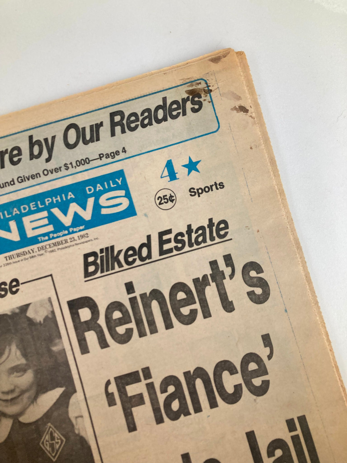 Close-up of the Philadelphia Daily News Tabloid December 23 1982, displaying the price and sports section under the headline 'Reinert's Fiancé Gets Jail'.