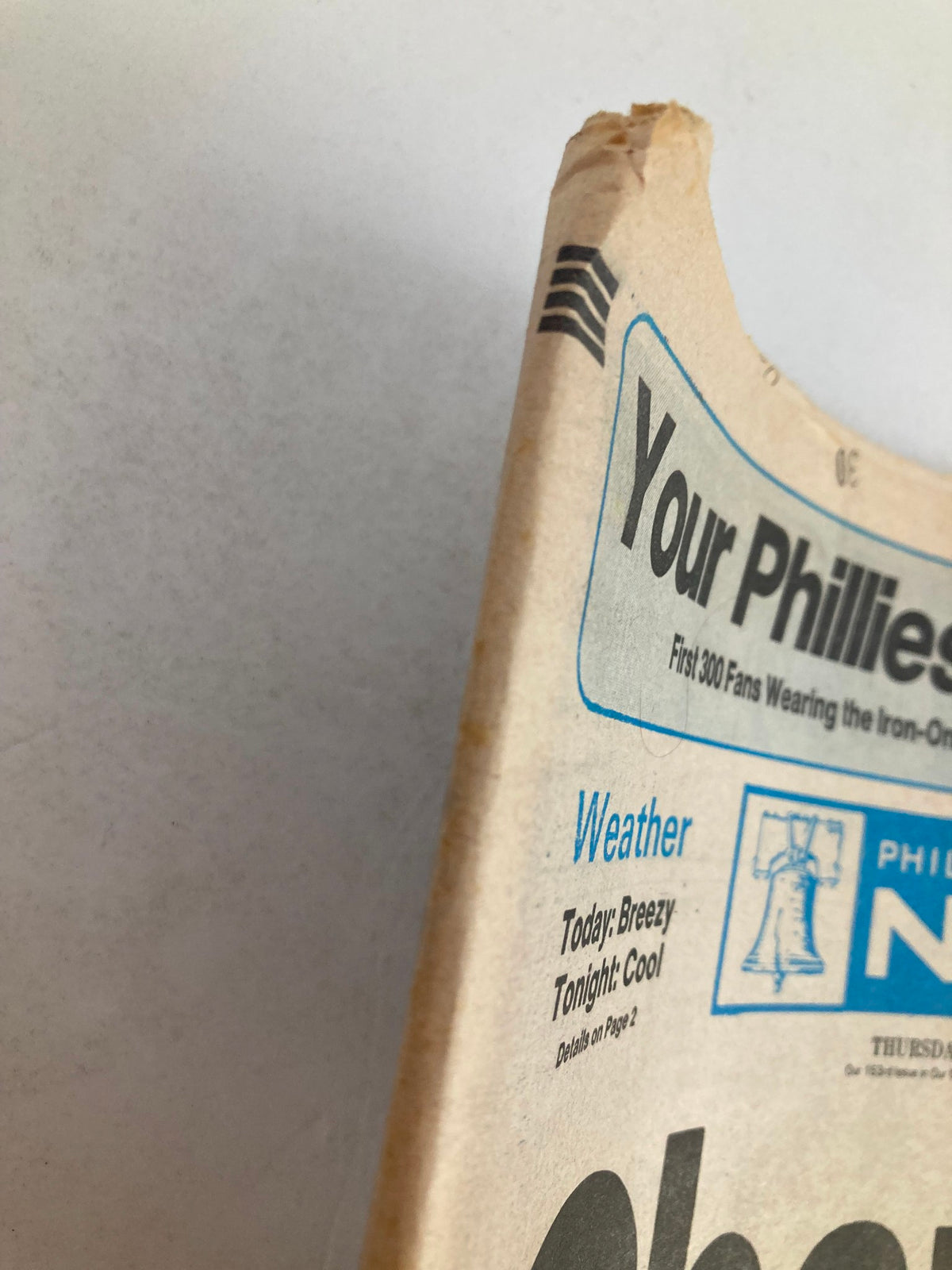 Close-up view of the Philadelphia Daily News tabloid's top corner, highlighting the weather section, dated September 29, 1983, related to the 'Pope Baptized' story.