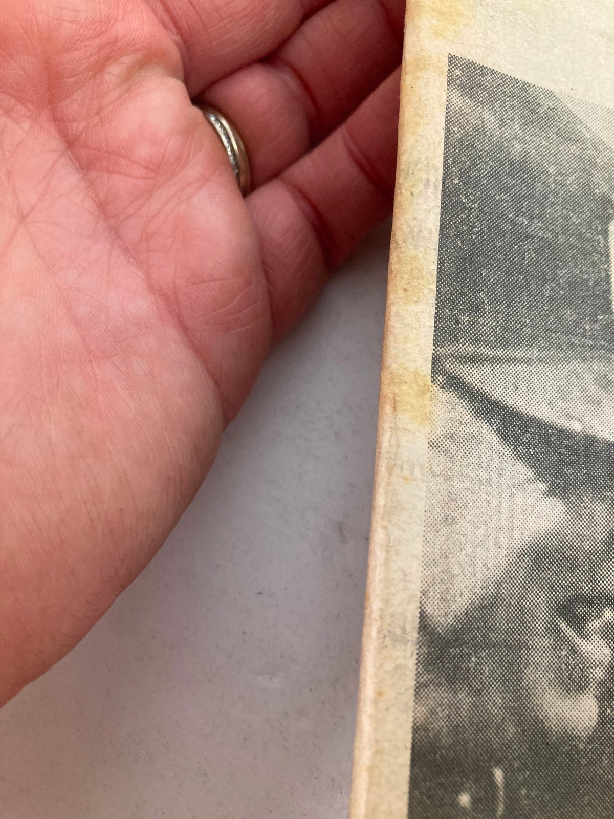 Detailed shot of the edge of the Philadelphia Daily News tabloid, showing minor wear and tear, dated September 29, 1983, associated with the 'Pope Baptized' headline.