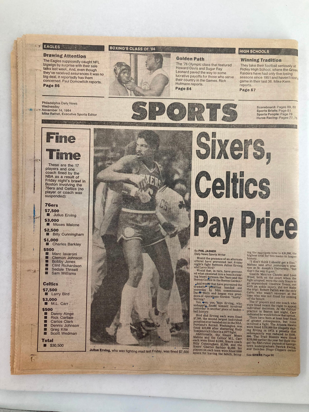 Philadelphia Daily News Tabloid from November 14, 1984 featuring highlights on sports including Julius Erving and Larry Bird. The front page includes a detailed summary of the Sixers vs. Celtics game along with player statistics and fines listed.
