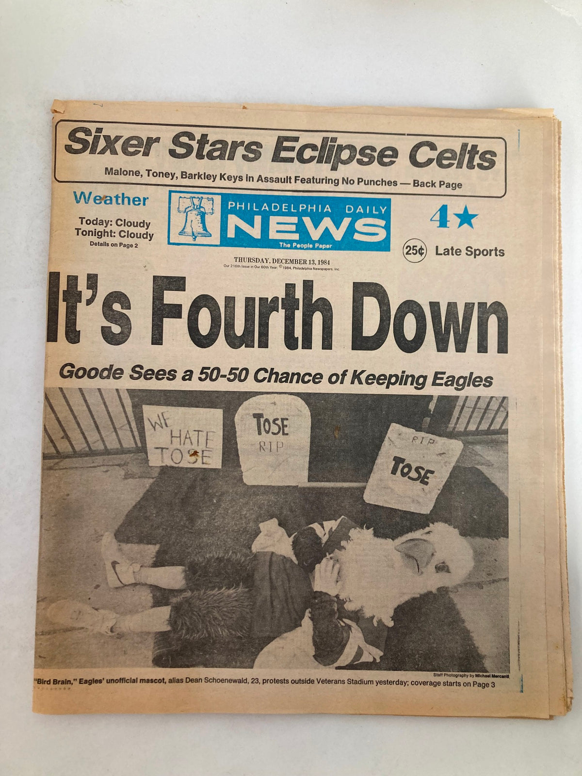 Philadelphia Daily News Tabloid from December 13, 1984, featuring Dean Schoenewald as Bird Brain, discussing a protest outside Veterans Stadium, showcasing signs that read 'We Hate Tose' and 'RIP Tose'.