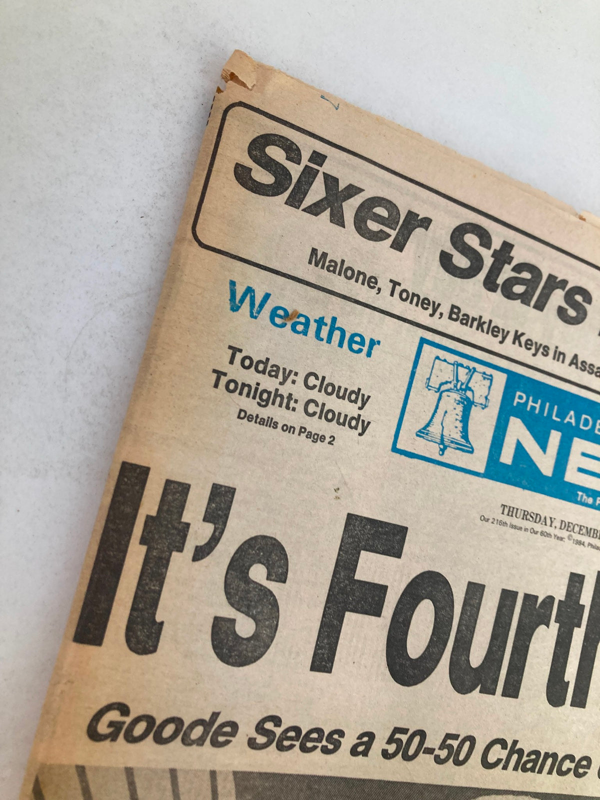 Close-up view of the Philadelphia Daily News Tabloid from December 13, 1984, highlighting the weather section with details on cloudy conditions.