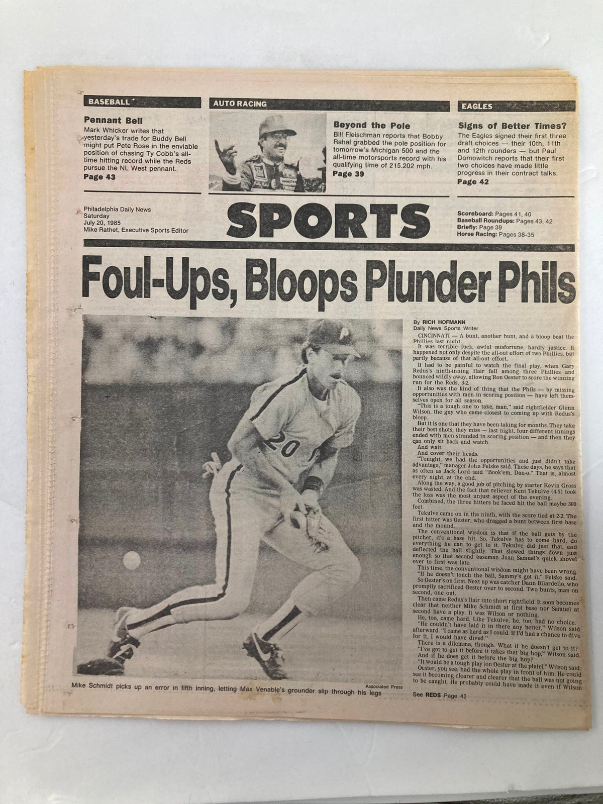 Philadelphia Daily News Tabloid from July 20, 1985, featuring sports news, headlines, and statistics. The article includes coverage of a Philadelphia Phillies baseball game with a focus on players' performance. Good condition, protected with plastic covering. Minor wear on the newspaper and some marks visible in the photos.