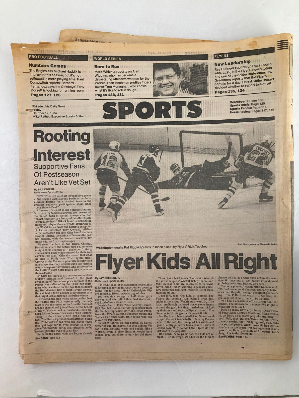 Philadelphia Daily News tabloid from October 12, 1984, covering sports news, including Washington goalie Pat Riggin blocking a shot during a game.