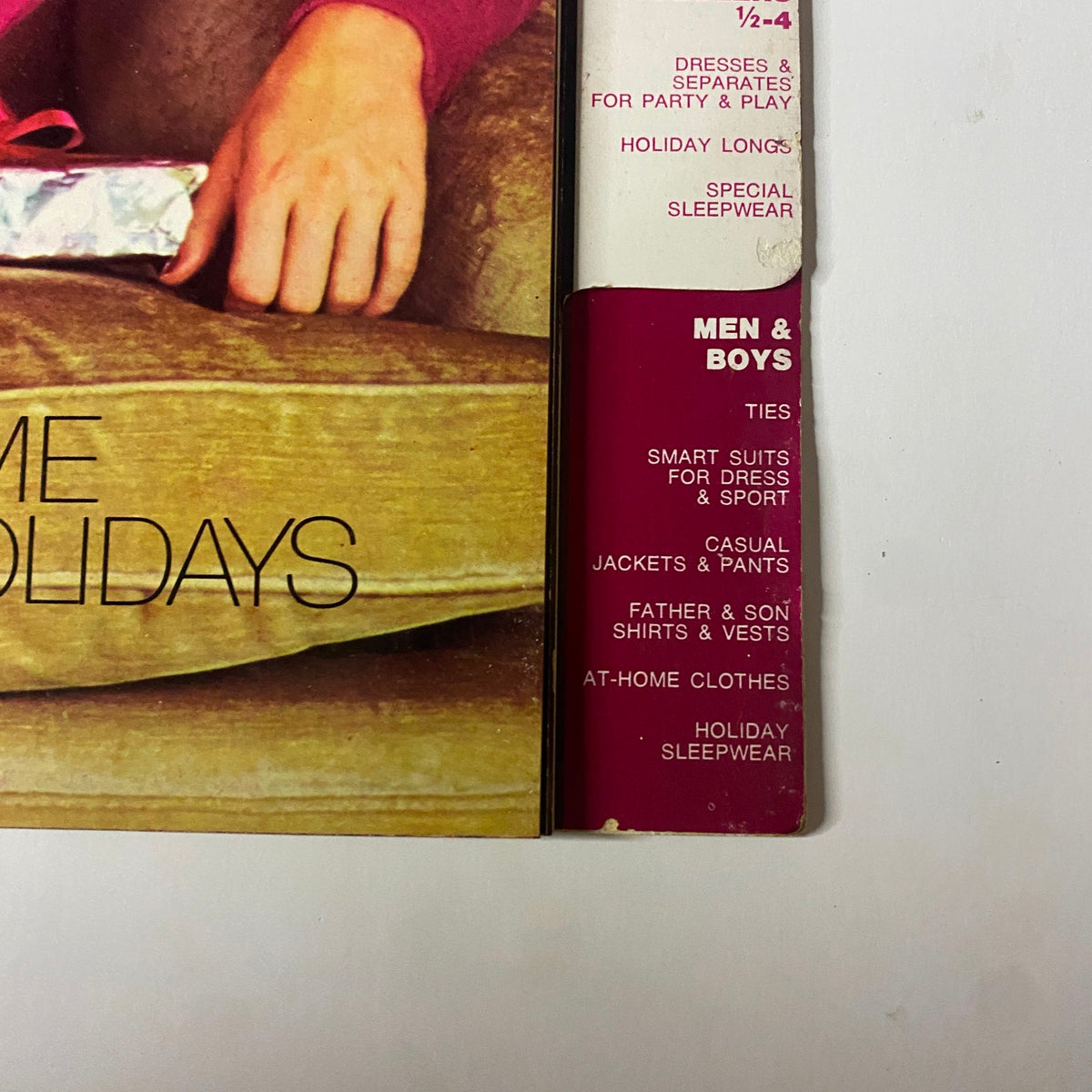 Interior page of the 1973 Simplicity Holiday Gift Catalog showcasing holiday outfits and gifts, with a focus on at-home fashion for the festive season.