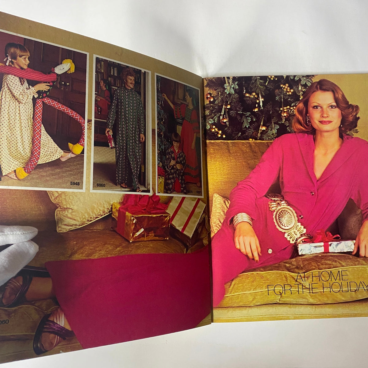 Spread from the 1973 Simplicity Holiday Gift Catalog displaying holiday fashion options, featuring cozy loungewear and vibrant styles.