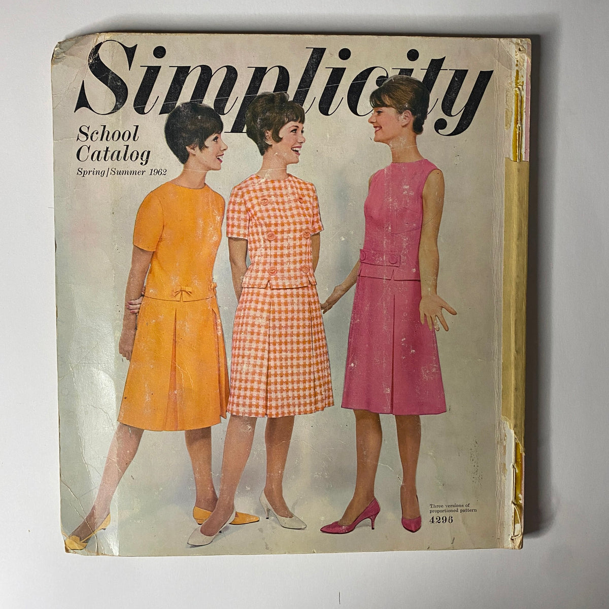 1962 Simplicity Spring Summer School Catalog cover featuring three women in stylish dresses showcasing vintage fashion patterns for school wear, demonstrating classic styles from the early 1960s.