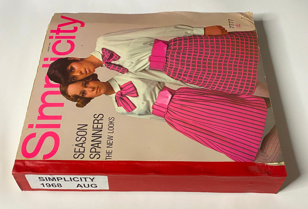 Side view of the 1968 August Simplicity Catalog highlighting two models in pink and gray outfits with bold accessories, emphasizing the key fashion looks of the late 1960s.