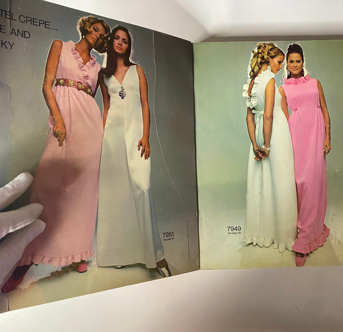 1968 December Simplicity Catalog Sewing Pattern featuring two models wearing elegant evening dresses in pink and white, showcasing styles from the late 1960s.