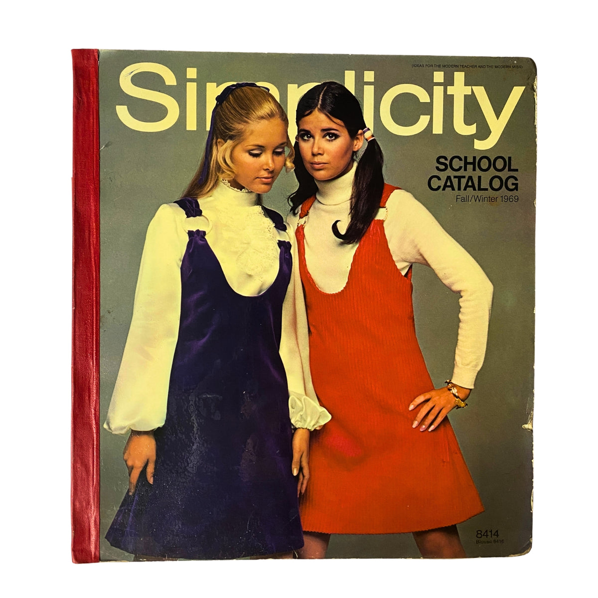 1969 Simplicity Fall and Winter School Catalog featuring two models in fashionable outfits, one wearing a purple dress and the other in an orange dress, showcasing vintage sewing patterns on the cover.