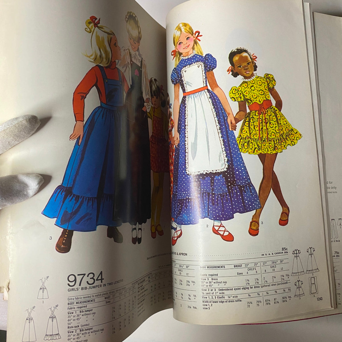 1971 January Simplicity Catalog highlighting girls' dresses, featuring a variety of colorful designs including aprons and playful styles for children.