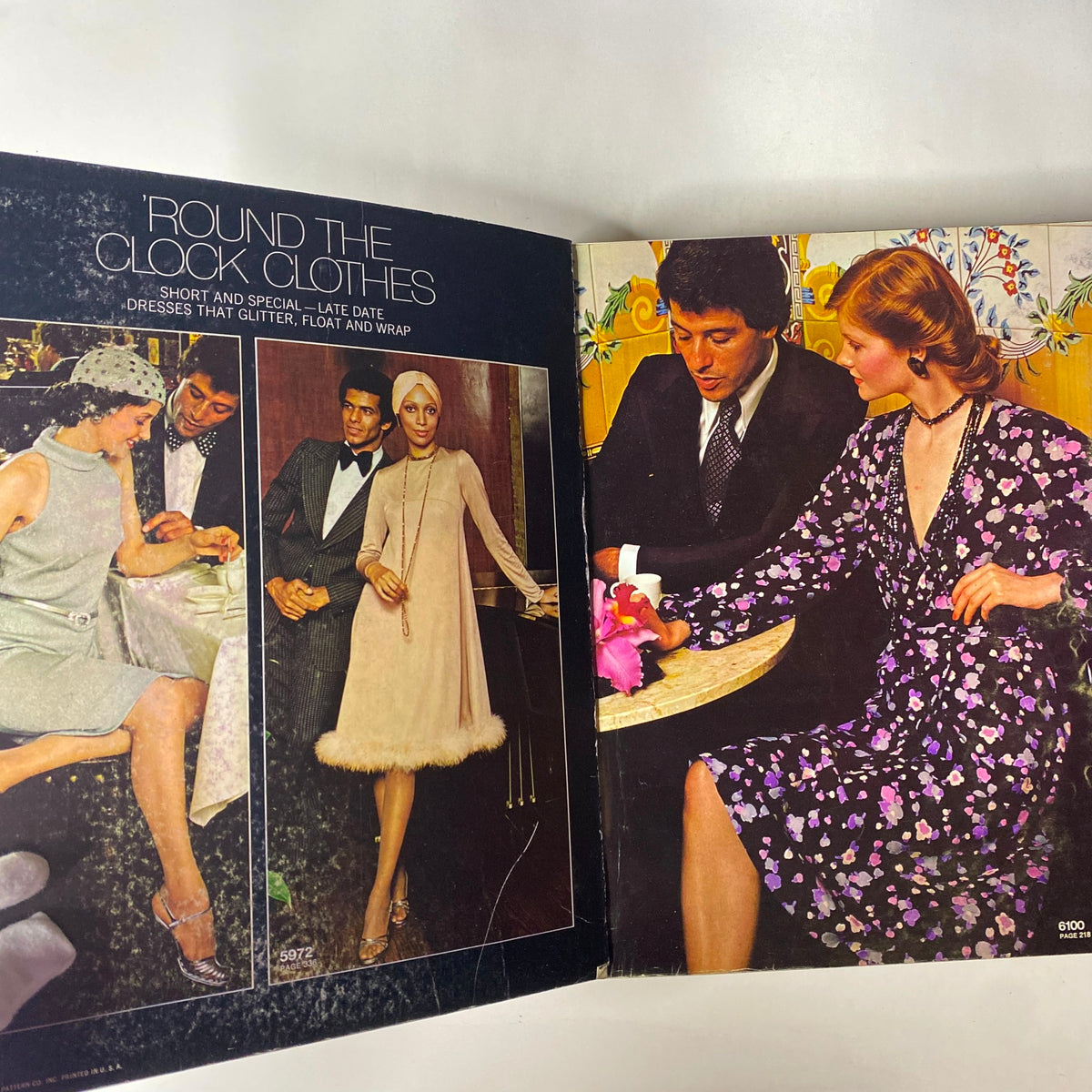 1973 January Simplicity Catalog showcasing 'Round the Clock Clothes' with elegant dresses and couples in a stylish setting. Ideal for fashion enthusiasts and vintage collectors.