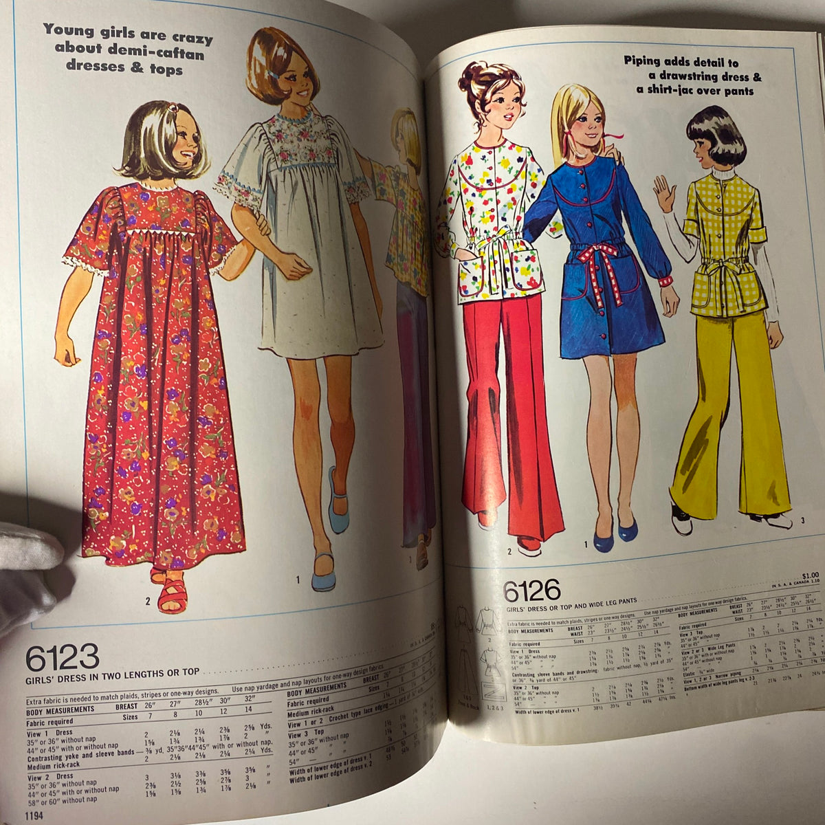 1973 January Simplicity Catalog displaying sewing patterns for girls' clothing. Features dresses and tops, showcasing playful and stylish designs for young girls.