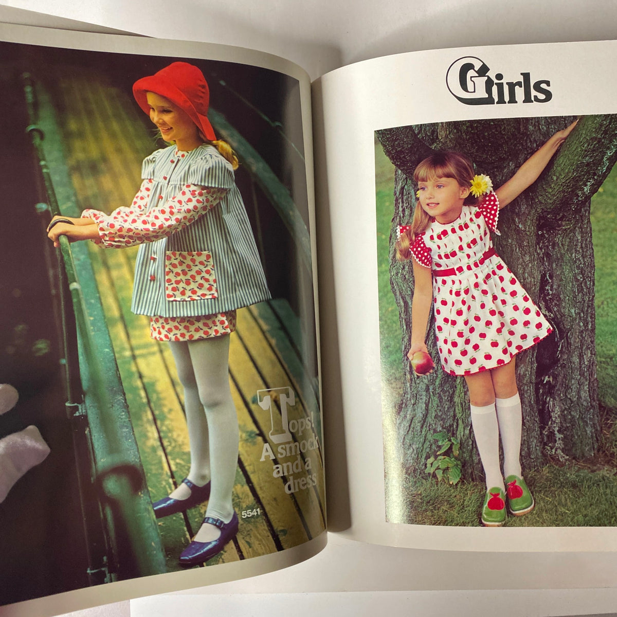 1973 Simplicity Spring and Summer Catalog showing girls' spring fashion with bright playful designs including a striped smock and a polka-dot dress.