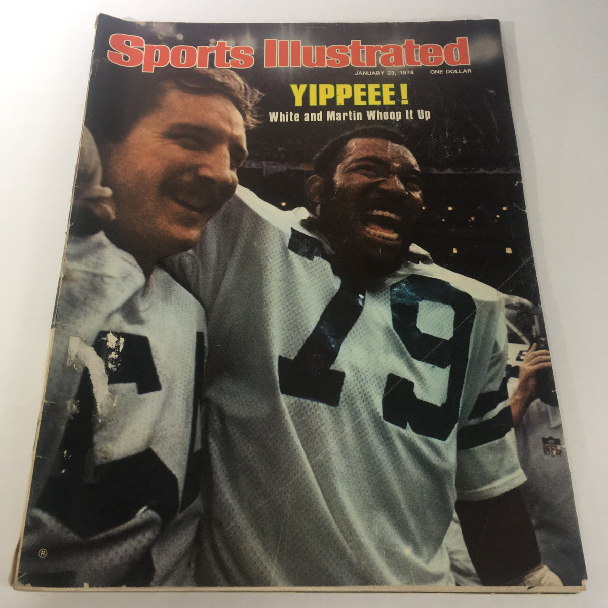 Cover of Sports Illustrated Magazine dated January 23, 1978, featuring NFL players Danny White and Harvey Martin celebrating with smiles.