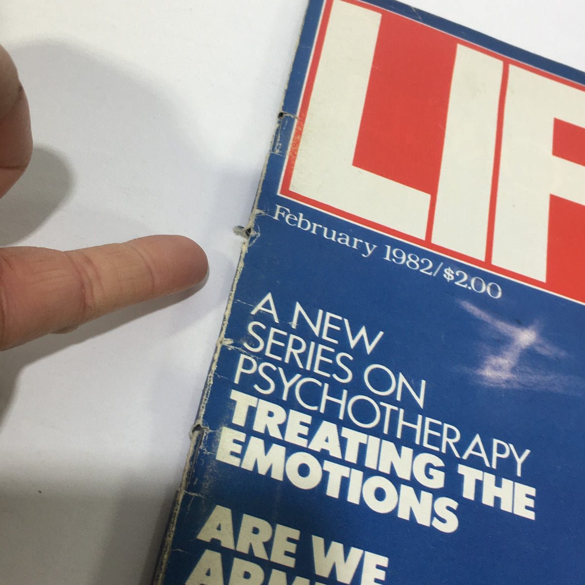 Detail of the top edge of the February 1982 Life Magazine, showcasing the title and headlines including psychotherapy treatment and nuclear showdown.