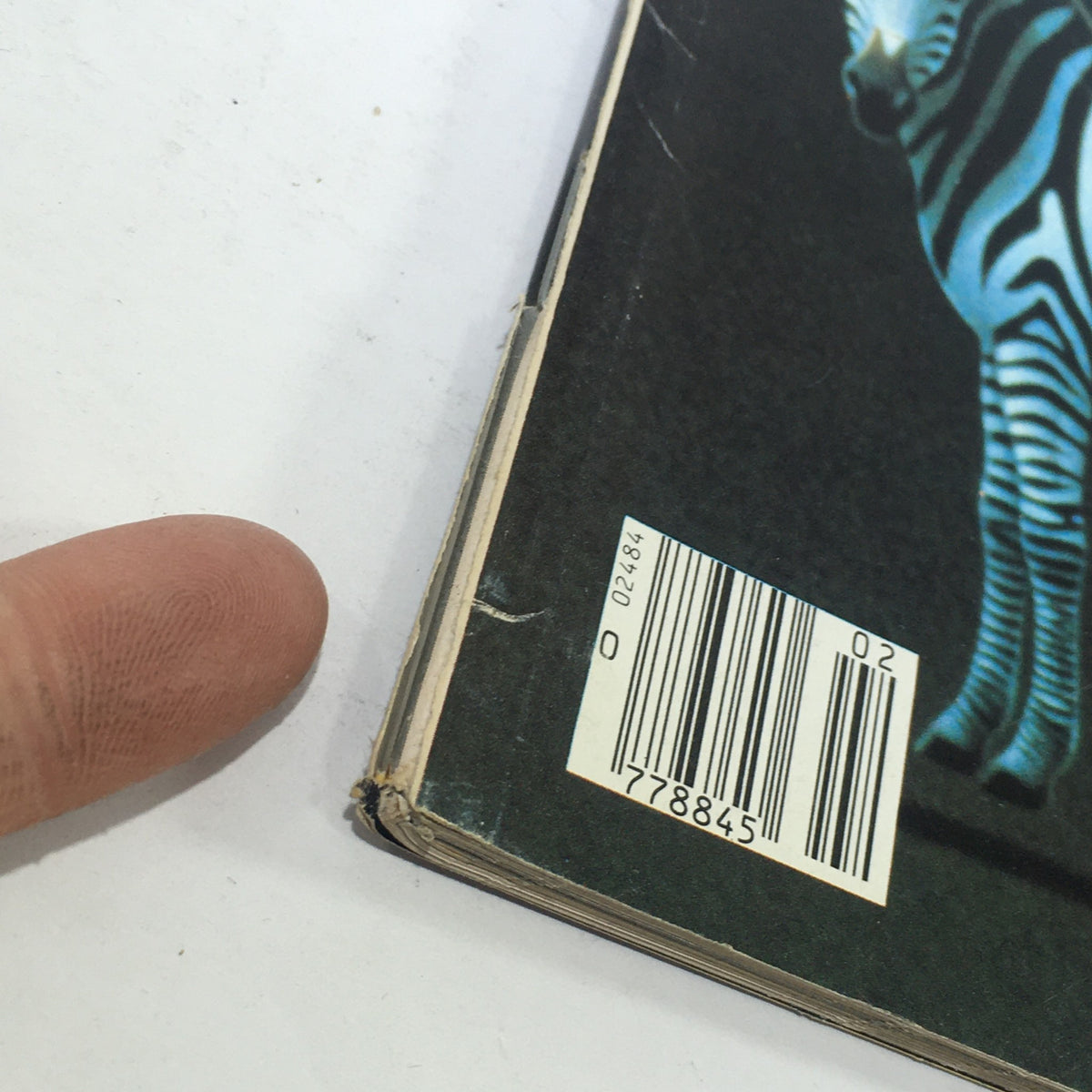 Close-up of the spine of VTG Omni Magazine: February 1982 showing the barcode and wear typical of vintage magazines.