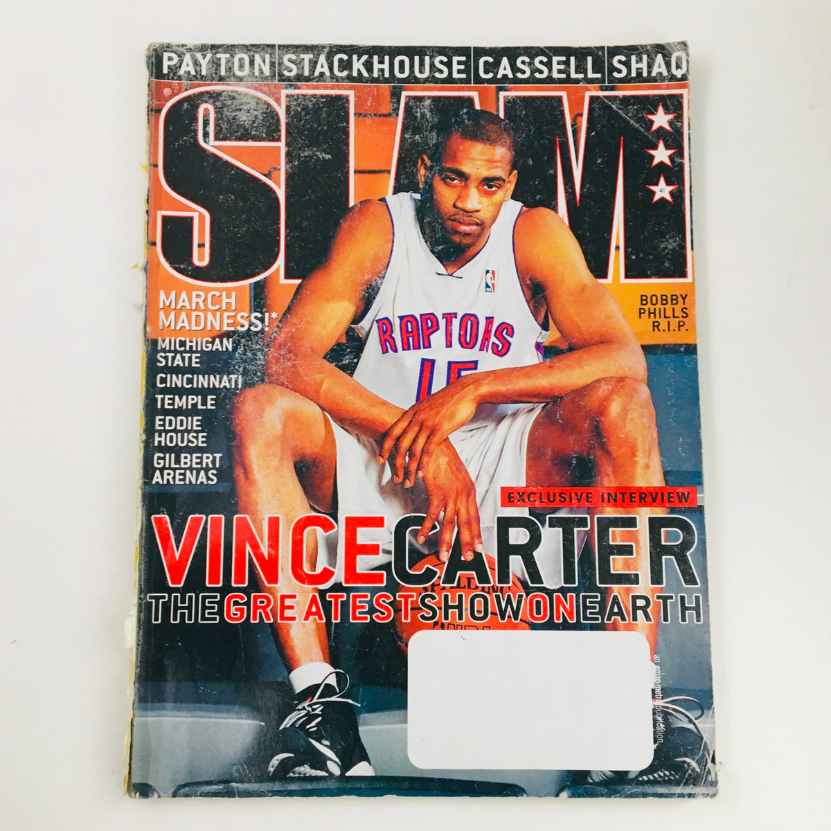 Slam Magazine April 2000 featuring Vince Carter on the cover, showcasing the title 'VINCE CARTER THE GREATEST SHOW ON EARTH'. The magazine highlights notable basketball figures including Shaquille O'Neal and Sam Cassell, making it a must-have for collectors.