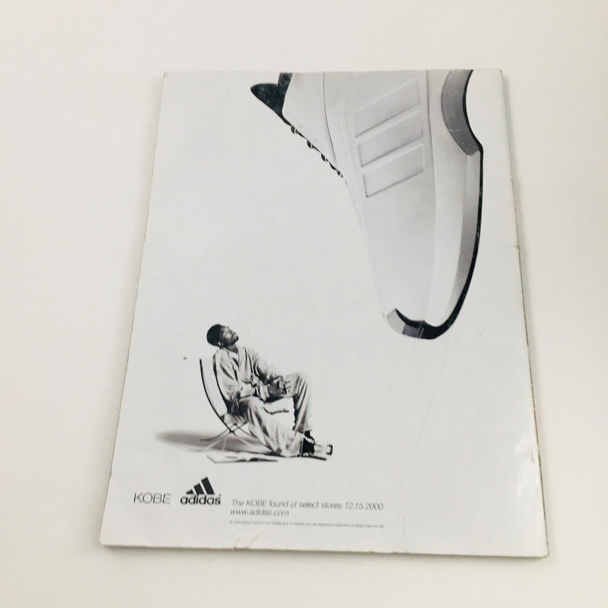 Slam Magazine February 2001 back cover with a sleek advertisement featuring Kobe Bryant for Adidas, highlighting basketball footwear and style.
