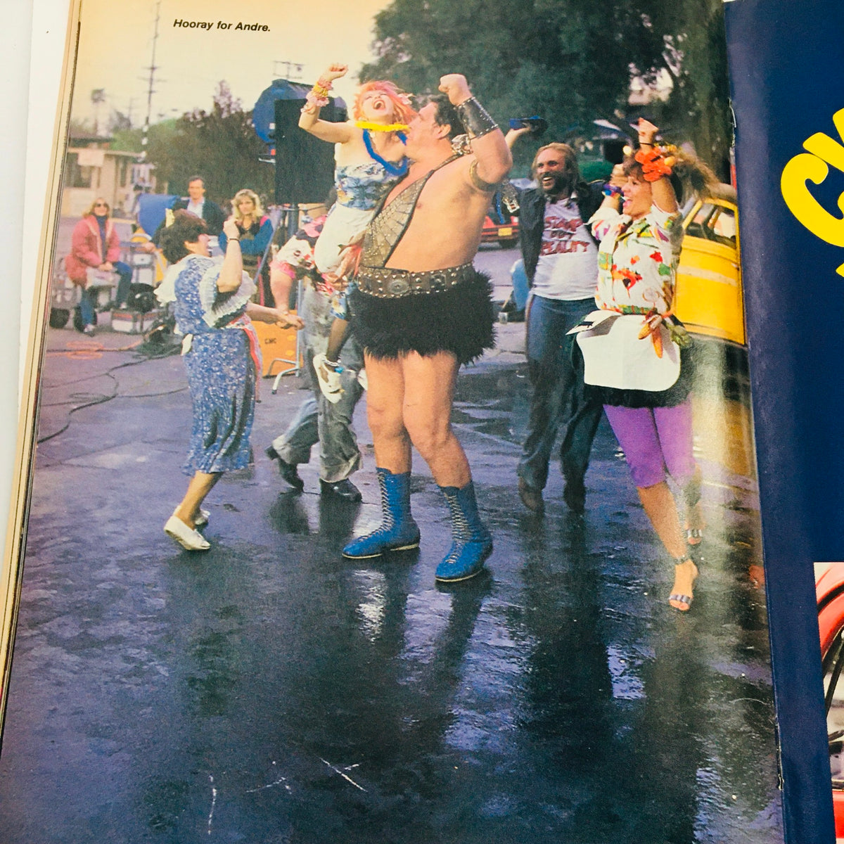 WWF Magazine August 1985 Cyndi Lauper celebrating with Andre the Giant, capturing a playful moment from the circus-themed issue.