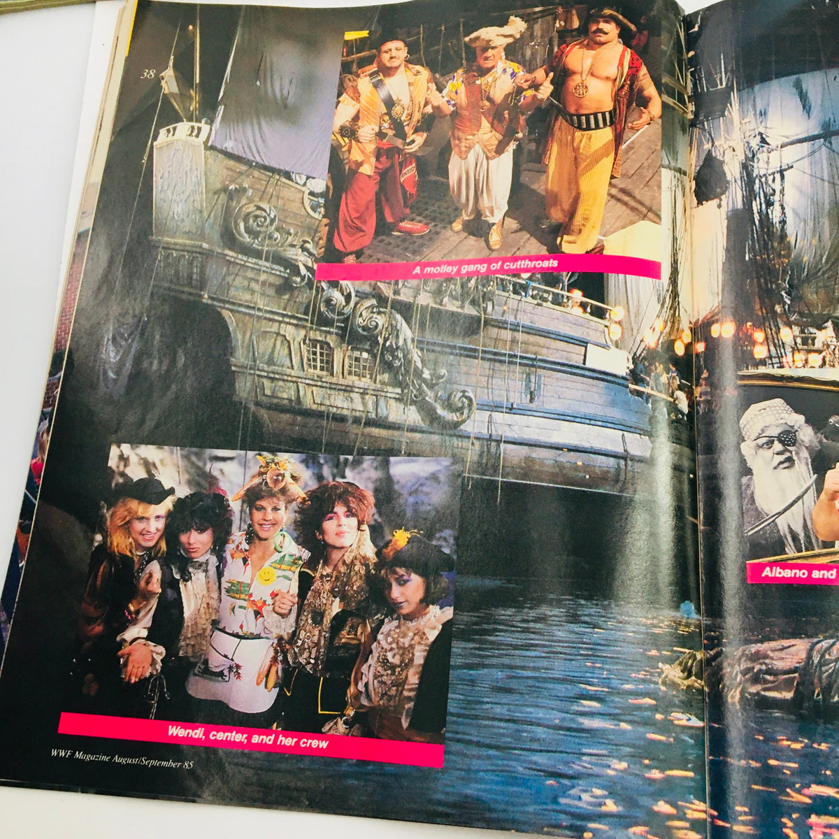 WWF Magazine August 1985 features a colorful image of a motley group of characters at a circus, including Wendi and her crew, highlighting the playful crossover of wrestling and pop culture.