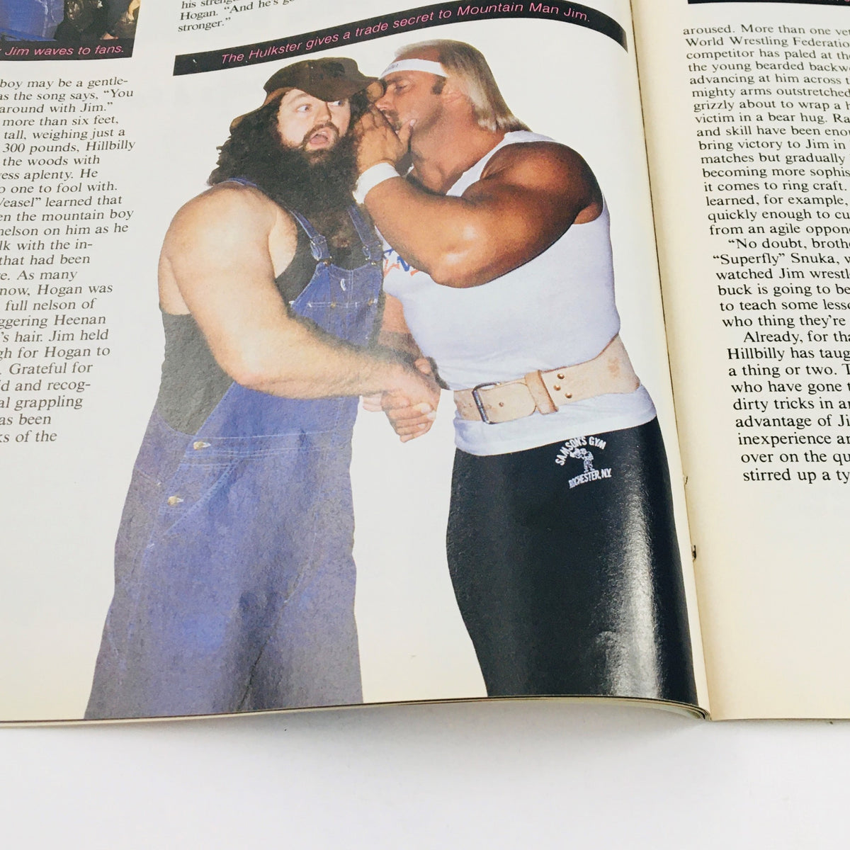 Image from WWF Magazine April 1985 featuring Hulk Hogan and Hillbilly Jim sharing a moment, highlighting camaraderie in wrestling culture.