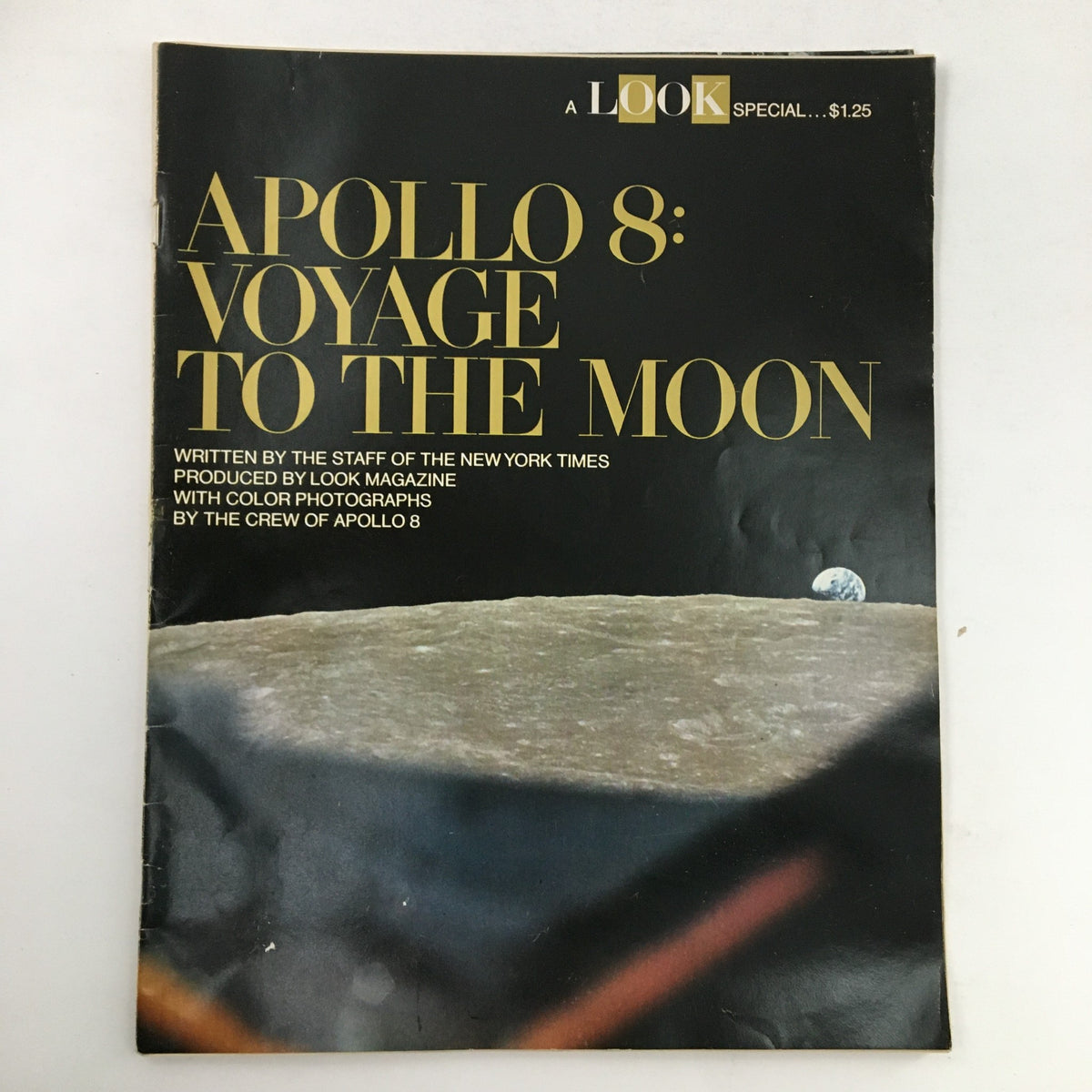 Cover of Look Magazine Special from 1969 titled 'Apollo 8: Voyage To The Moon', featuring the iconic title in bold lettering, details about the publication by the staff of The New York Times, and original color photographs associated with the Apollo 8 crew.