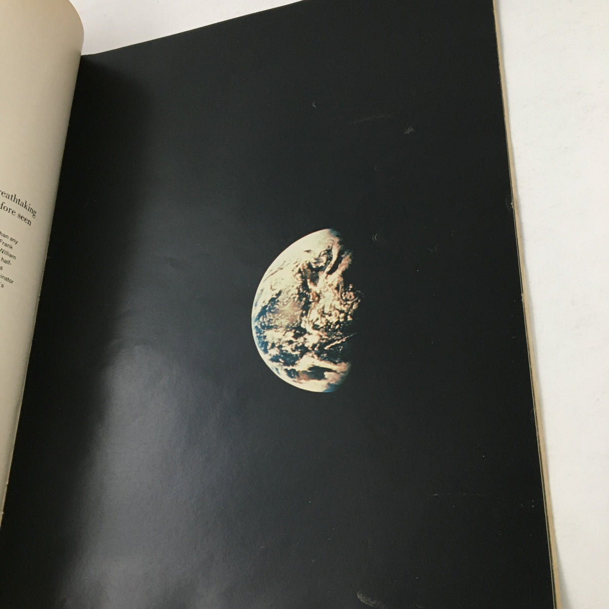 A striking image of Earth as seen from space, featured in Look Magazine Special 1969 about Apollo 8's historic lunar mission.