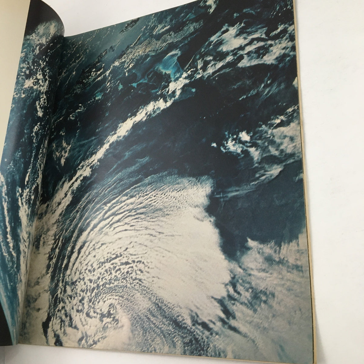 A captivating photo depicting the Earth's atmosphere and oceans taken during Apollo 8's mission, presented in Look Magazine Special 1969.