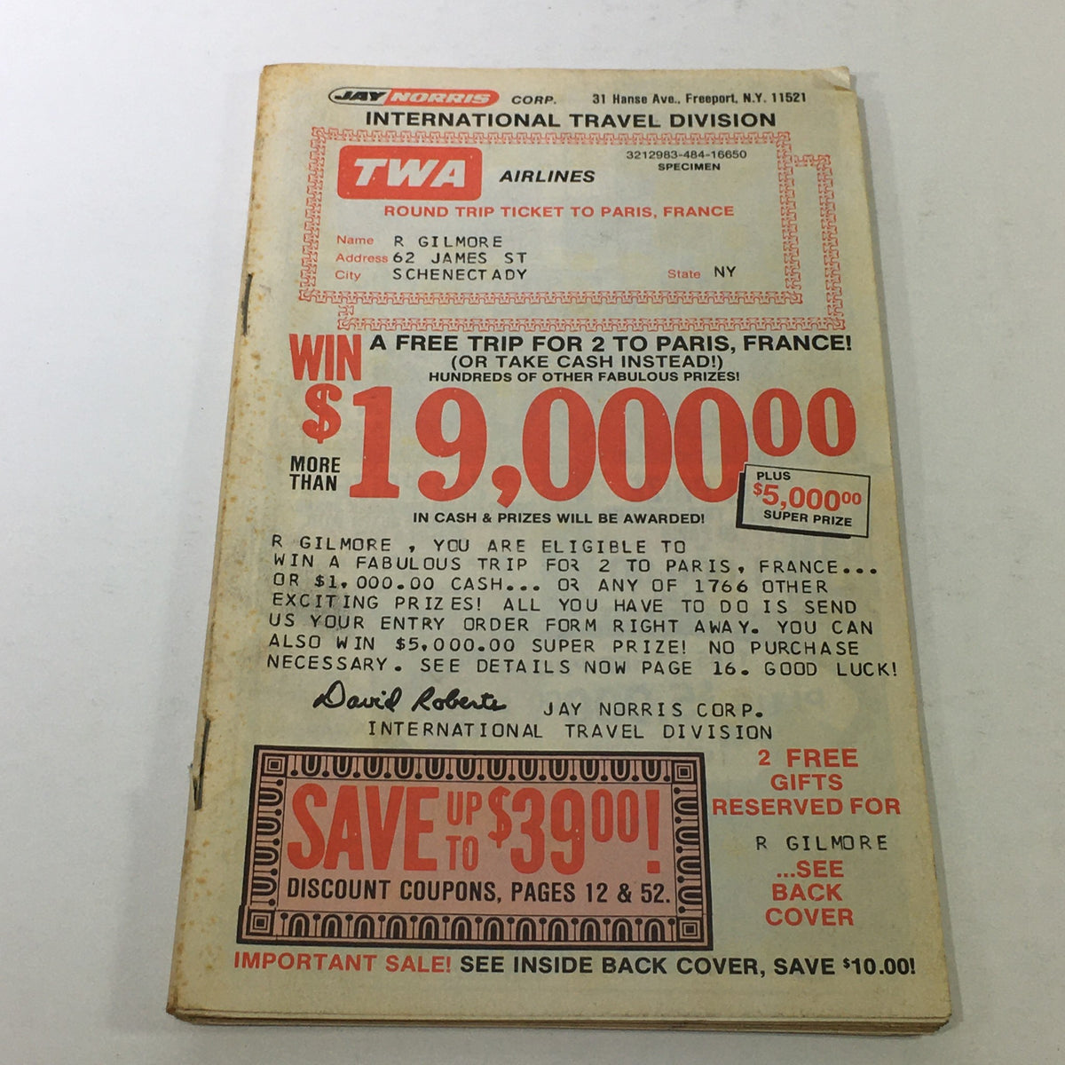 VTG 1977 Jay Norris Corporation Travel Division Price Guide Calendar Catalog featuring a promotional offer for a round trip ticket to Paris, France, with details about the contest and discount savings, on the cover in red and black text.