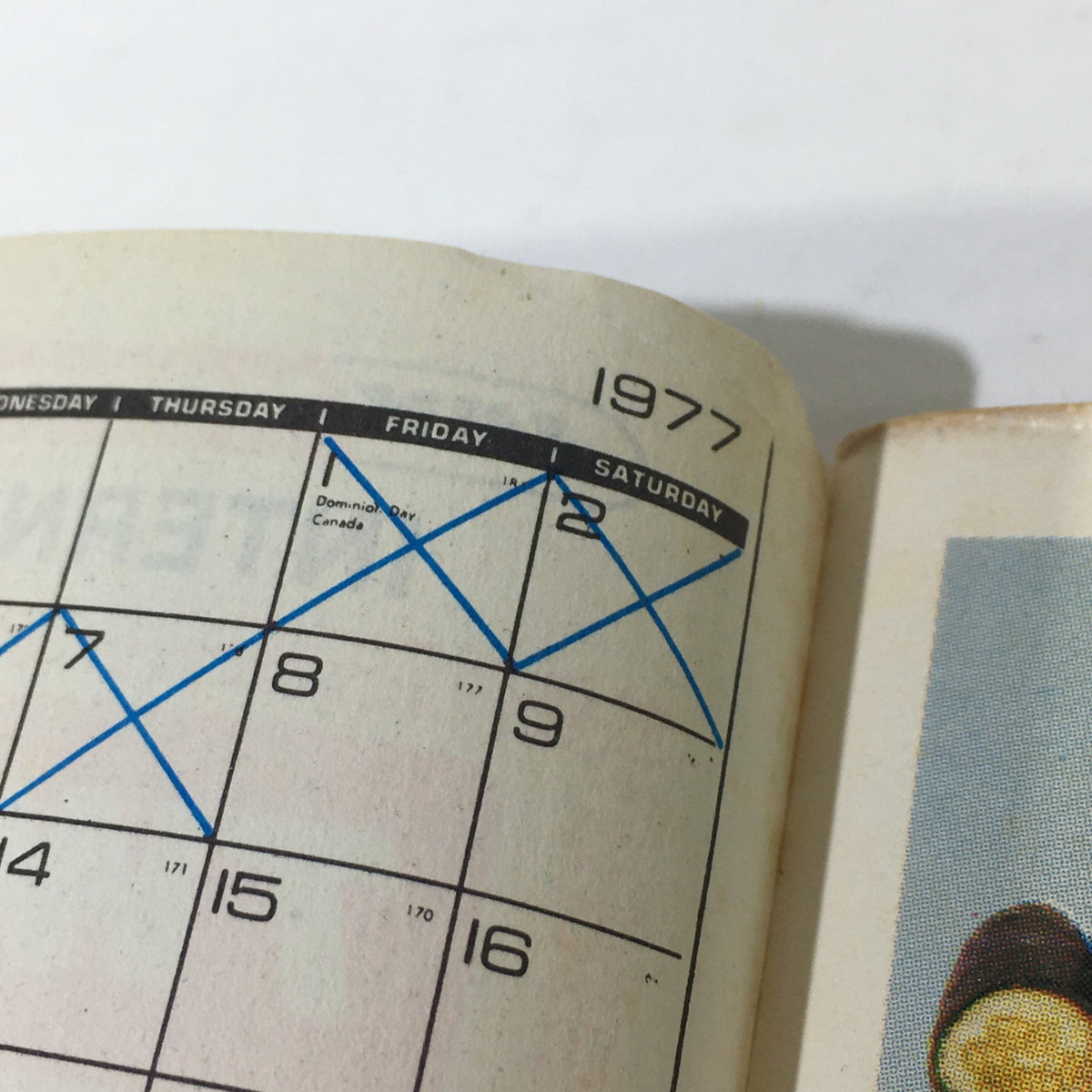 Close-up of a date marked on the 1977 calendar from the VTG 1977 Jay Norris Corporation Travel Division Price Guide Calendar Catalog.