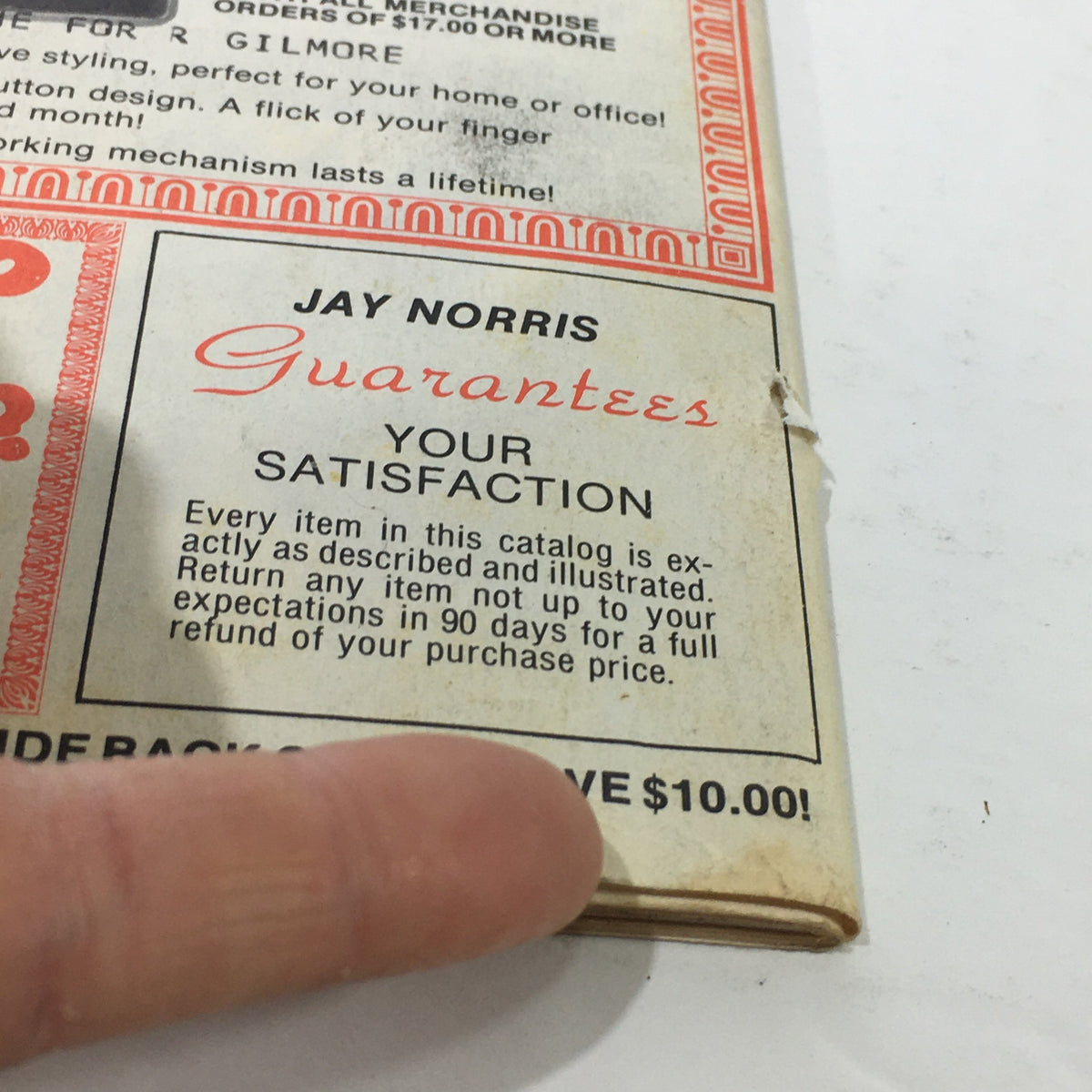 Close-up of the back cover of the VTG 1977 Jay Norris Corporation Travel Division Price Guide Calendar Catalog, highlighting the satisfaction guarantee and promotional savings.