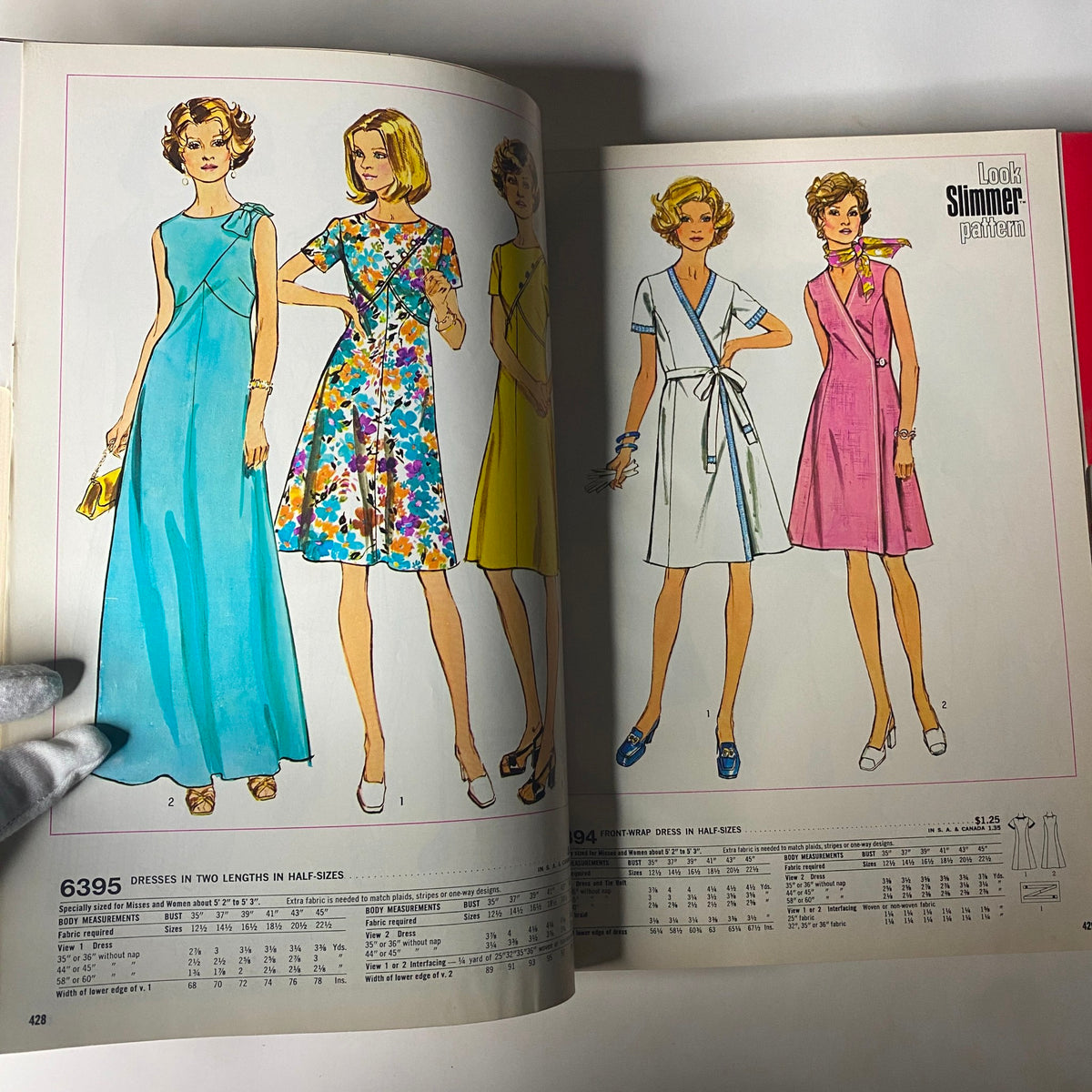 Two pages from the 1974 July Simplicity Summer Catalog showing dresses in various styles, including the 'Look-Slimmer' patterns for flattering designs.