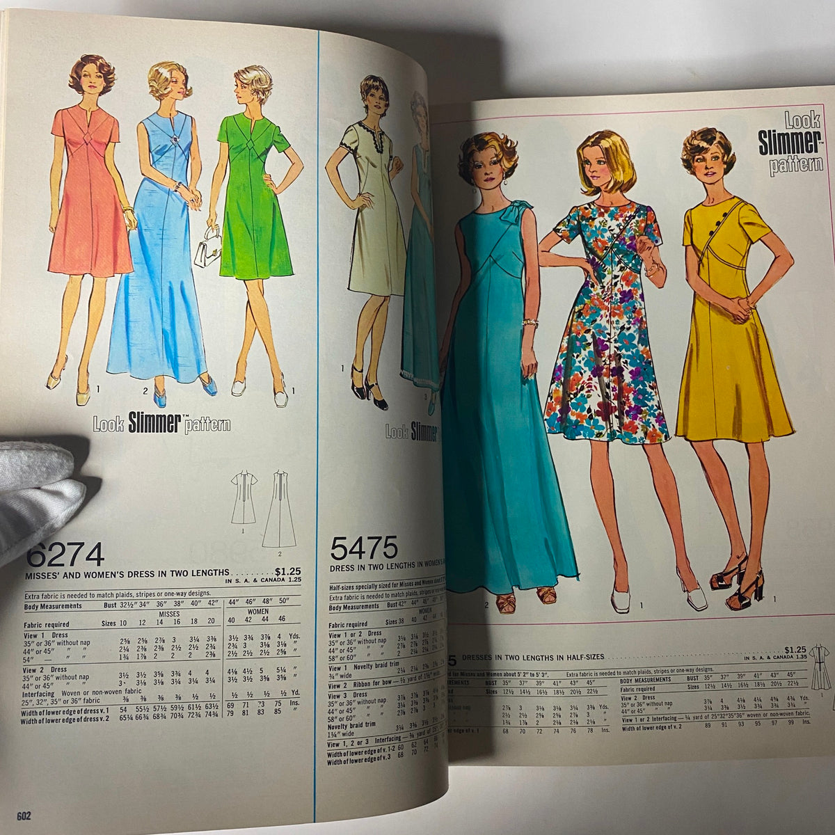 1974 July Simplicity Summer Catalog showcasing various dress patterns, including 'Look Slimmer' styles for misses and women in two lengths, featuring vibrant colors and floral designs.