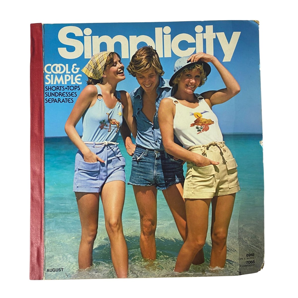 1975 August Simplicity Catalog featuring stylish summer sewing patterns with models showcasing halter tops, shorts, and skirts at the beach.