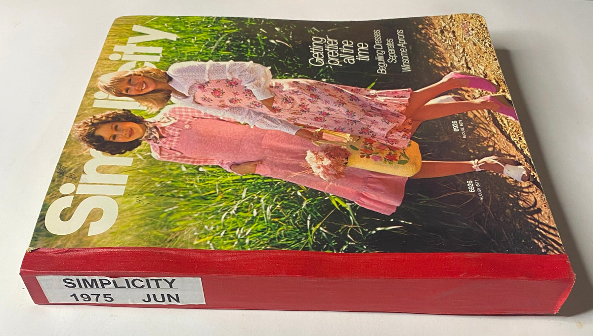 Side view of the 1975 June Simplicity Catalog highlighting its title and decorative spine, featuring summer fashion patterns including dresses and aprons for DIY sewing enthusiasts.
