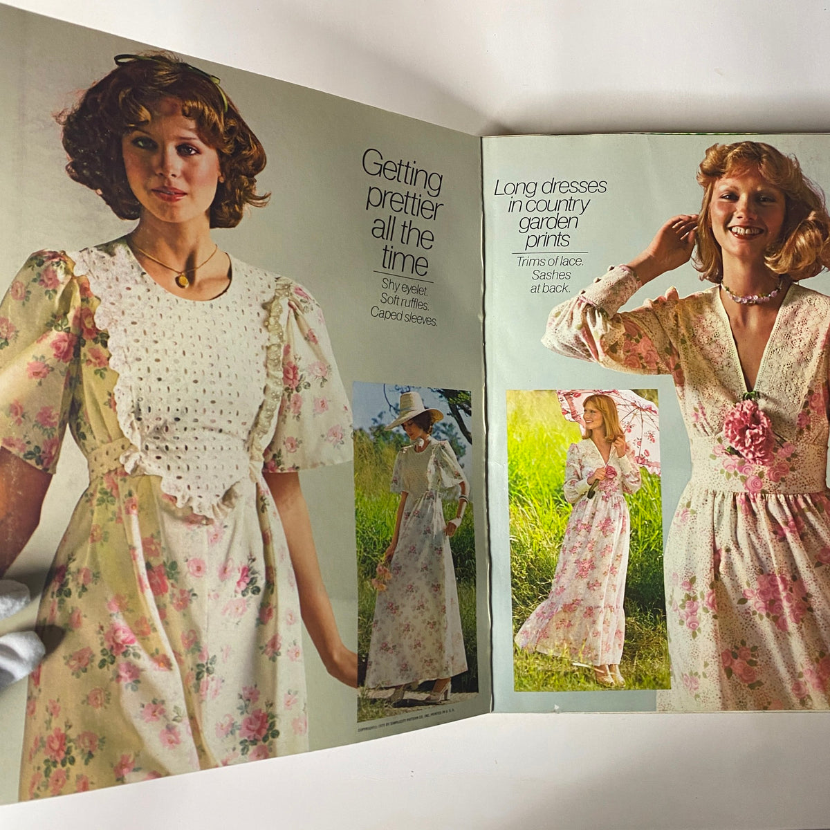 1975 June Simplicity Catalog Sewing Pattern displaying a collage of 1970s fashion looks including long dresses with floral prints, highlighting chic styles for summer.