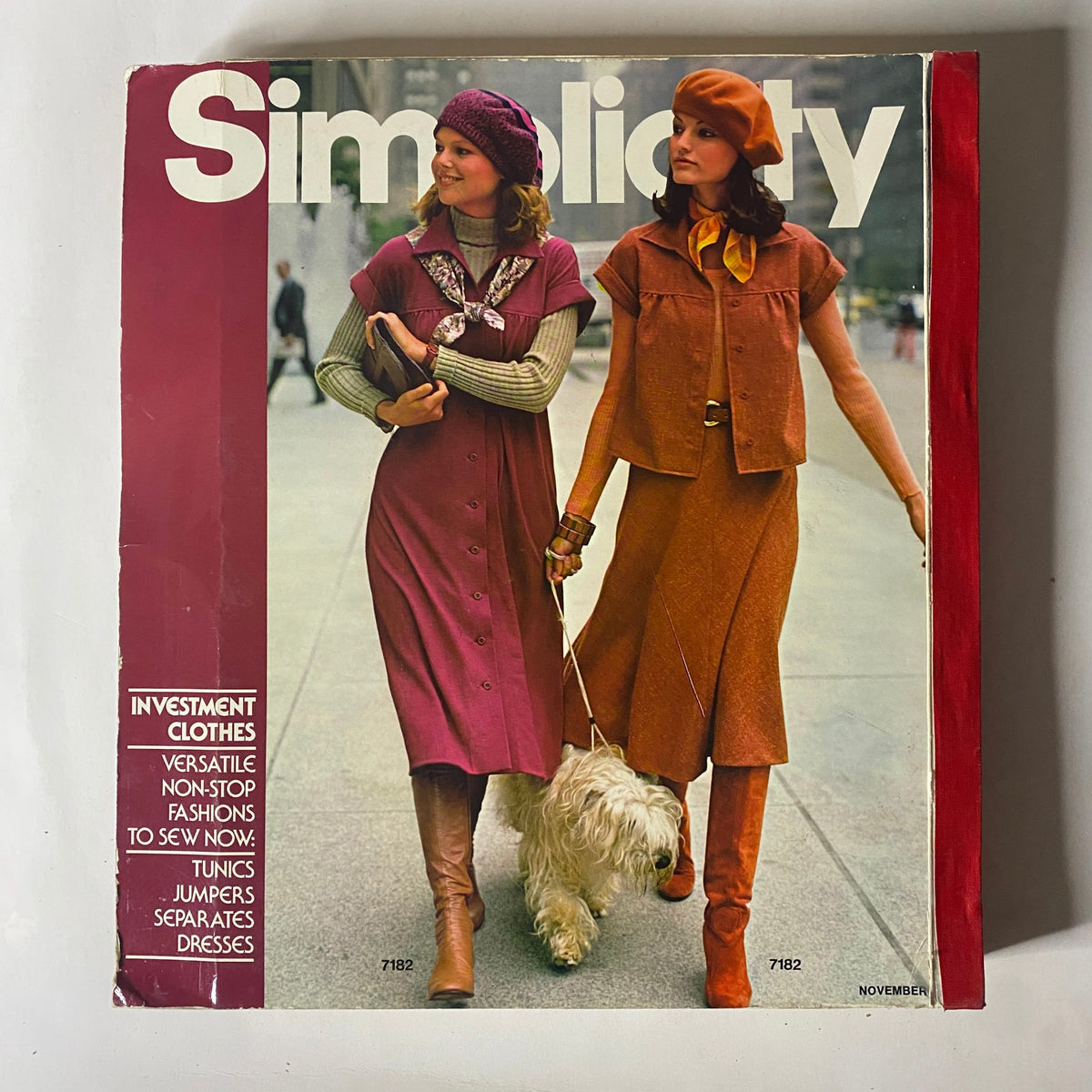 1975 November Simplicity Catalog cover displaying timeless ladies' fashion, highlighting versatile sewing patterns for tunics, jumpers, and dresses, perfect for autumn attire.