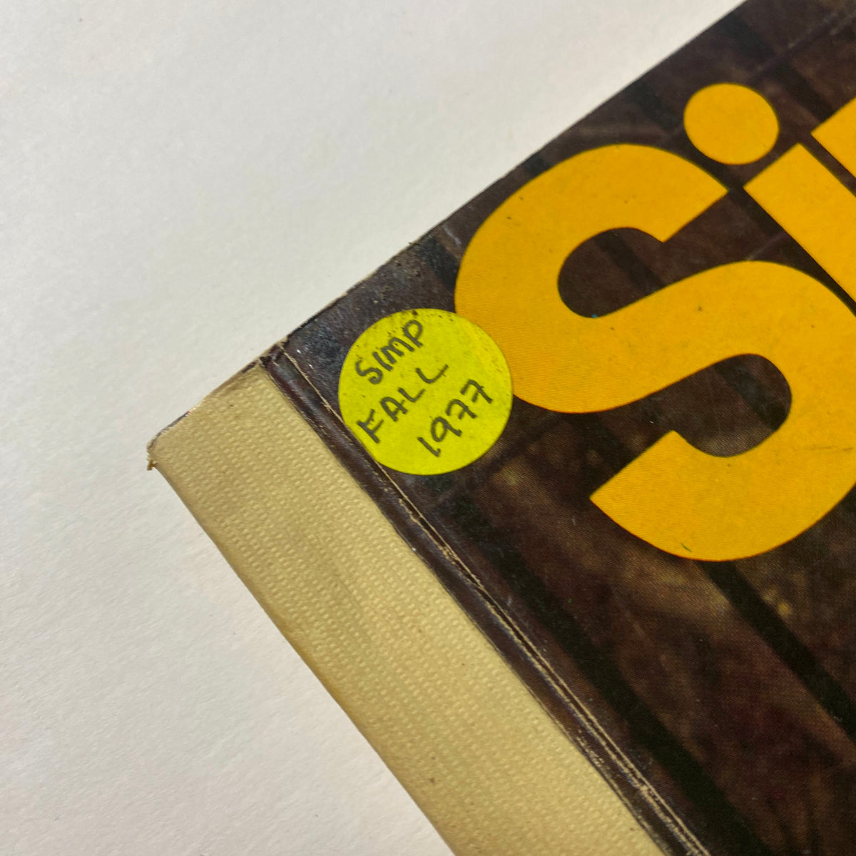 Close-up of the 1977 Simplicity Fall Catalog highlighting the catalog's title and year, indicating it's a vintage sewing pattern resource.