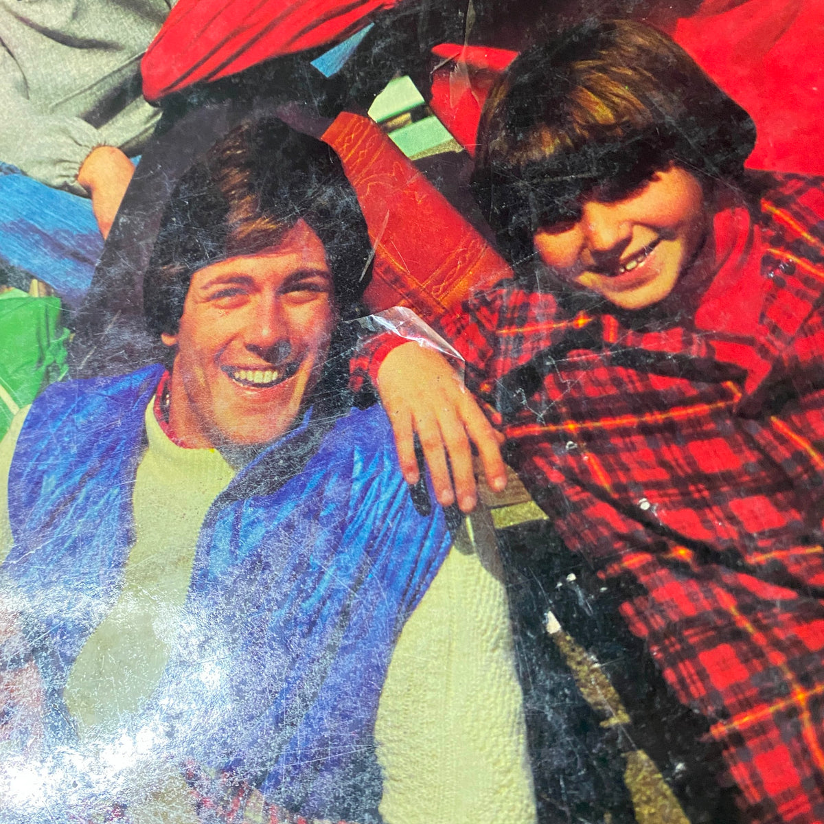 Image of two smiling models from the 1977 Simplicity Fall Catalog, showcasing 1970s casual fashion styles and vibrant colors.