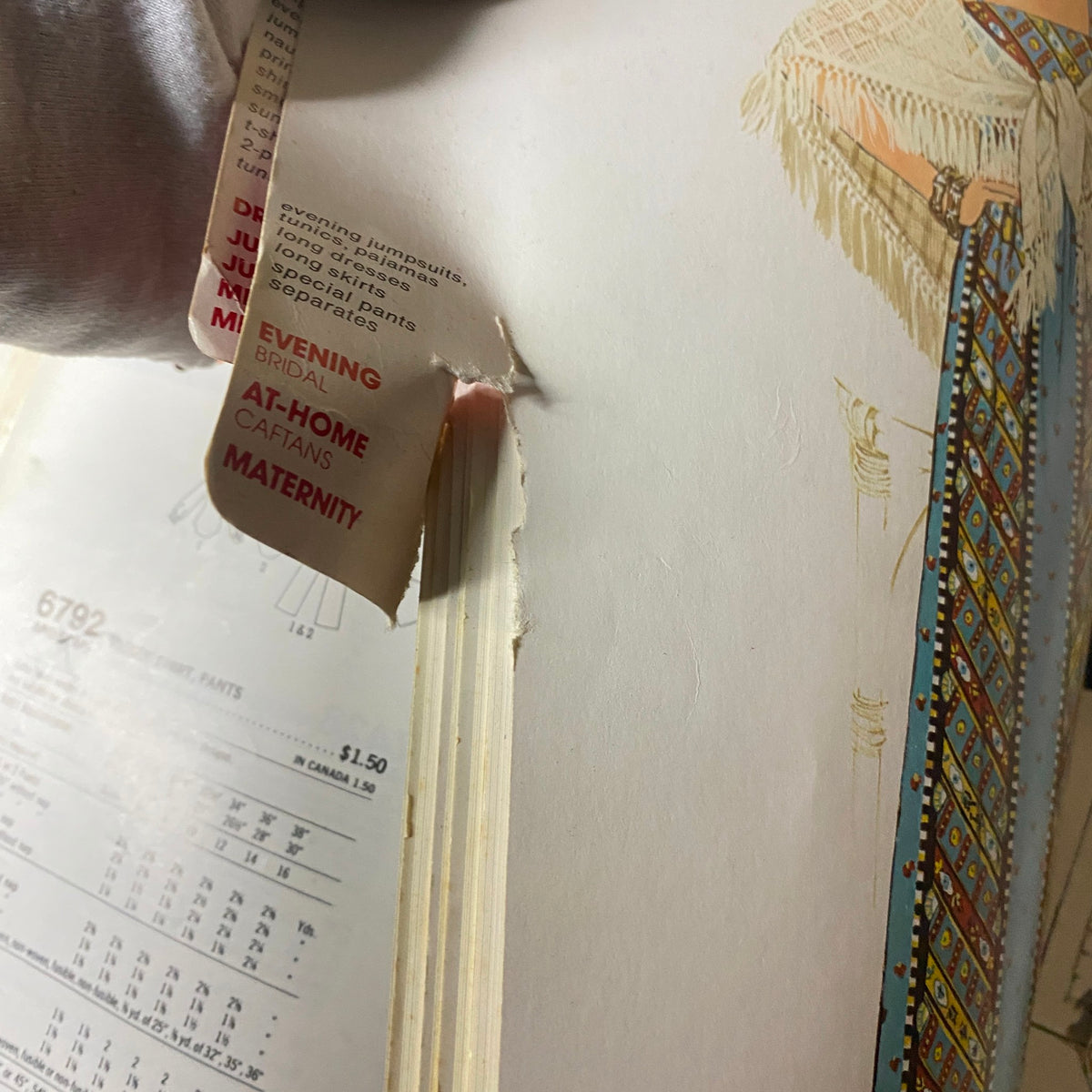 Close-up of the 1976 October Simplicity Sewing Pattern Catalog showing detailed patterns for evening wear and maternity options, preserving 1970s fashion.