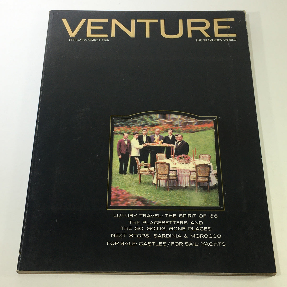 VTG Venture Magazine Book: February March 1966 cover featuring luxury travel theme with an outdoor dining setup and elegantly dressed individuals, showcasing the opulence of the travel world in the 1960s.
