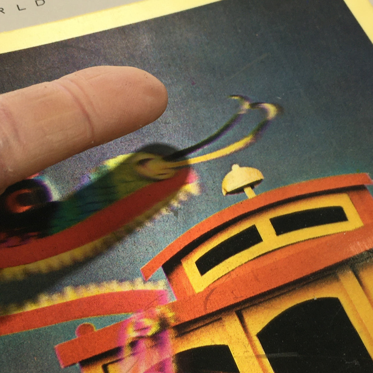 Close-up of the VTG Venture Magazine Book cover highlighting a colorful fish next to a vibrant cable car, illustrating the vintage style of the June 1965 issue.