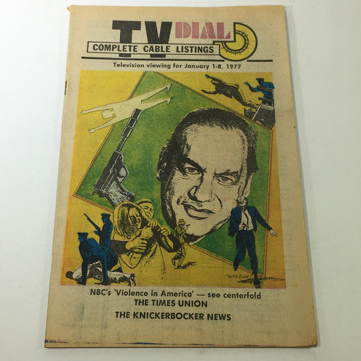 VTG TV Dial Complete Cable Listings January 1-8 1977 showcasing a colorful illustrated cover featuring a prominent figure and thematic elements from television history.