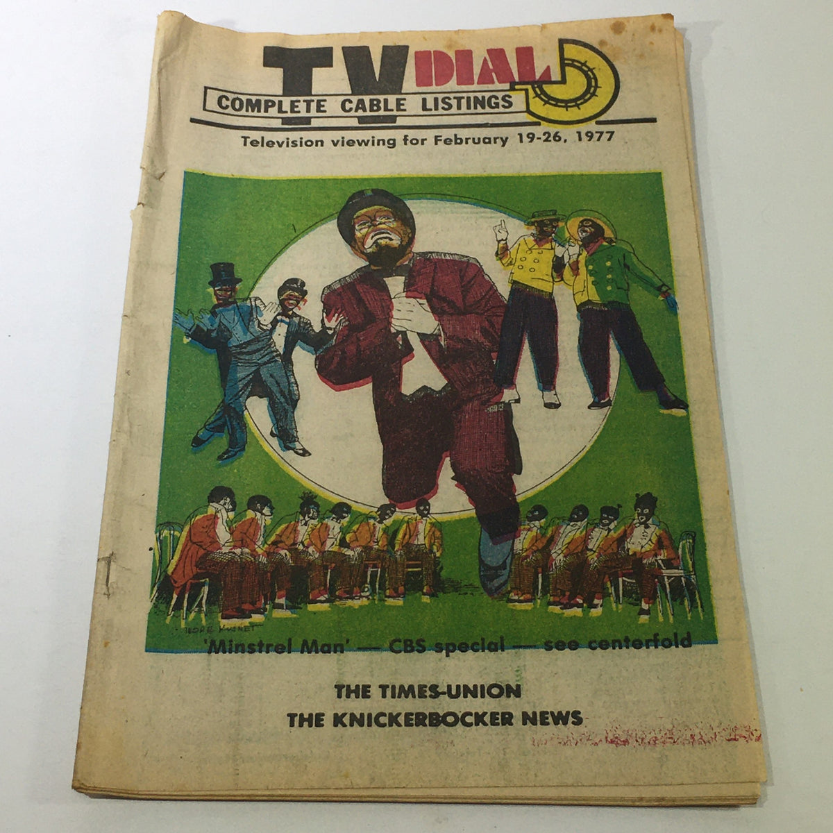 VTG TV Dial Complete Cable Listings February 19-26 1977 featuring Minstrel Man CBS Special on cover, showcasing vibrant illustrations of performers.