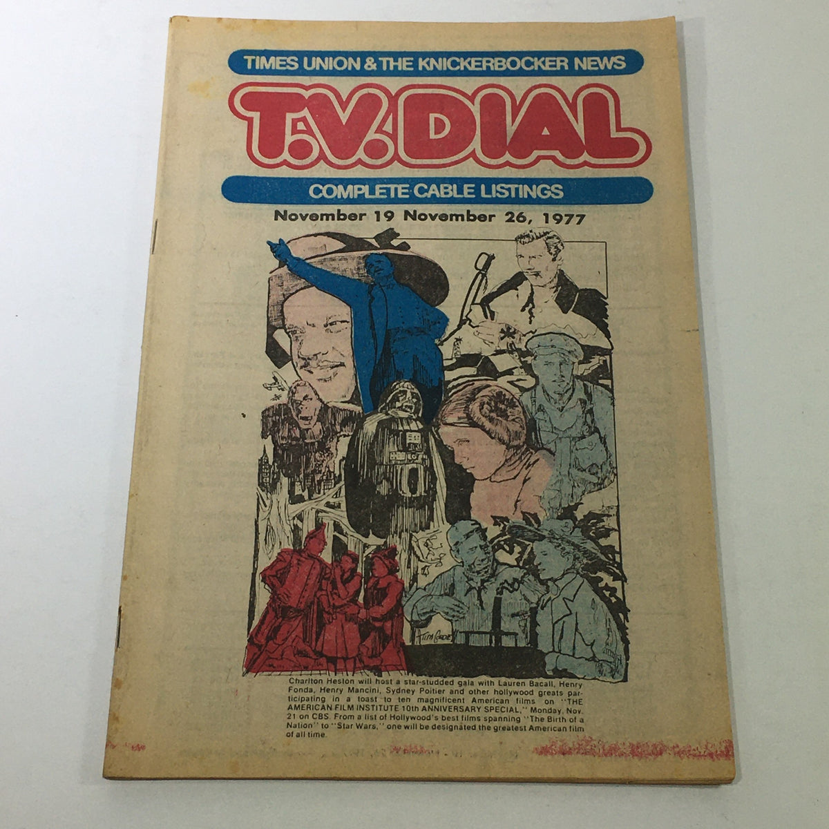 VTG TV Dial Complete Cable Listings November 19-26 1977 featuring artwork and images of Charlton Heston and other notable figures.