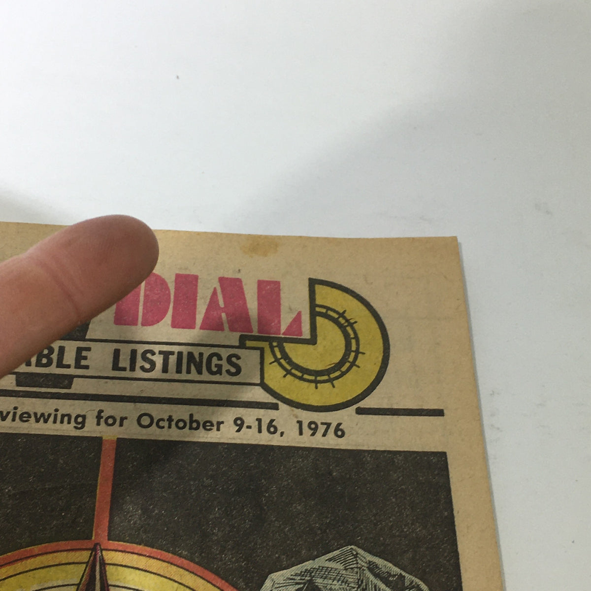 Detail view of VTG TV Dial Complete Cable Listings October 9-16 1976 showing the prominent title and cable listings information, capturing the vintage design elements of the 1970s.